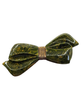 Load image into Gallery viewer, 1940s Carved Marbled Green Bakelite and Metal Bow Brooch
