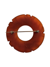 Load image into Gallery viewer, 1940s Rust Bakelite Carved Circle Brooch
